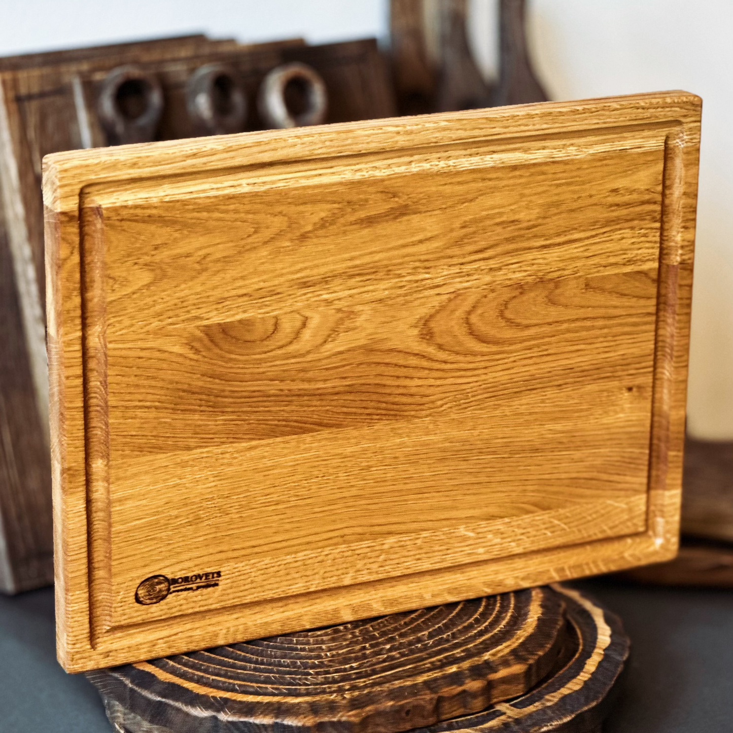 Rectangular oak cutting board with deep groove, ideal for carving meat, cheese, or vegetables