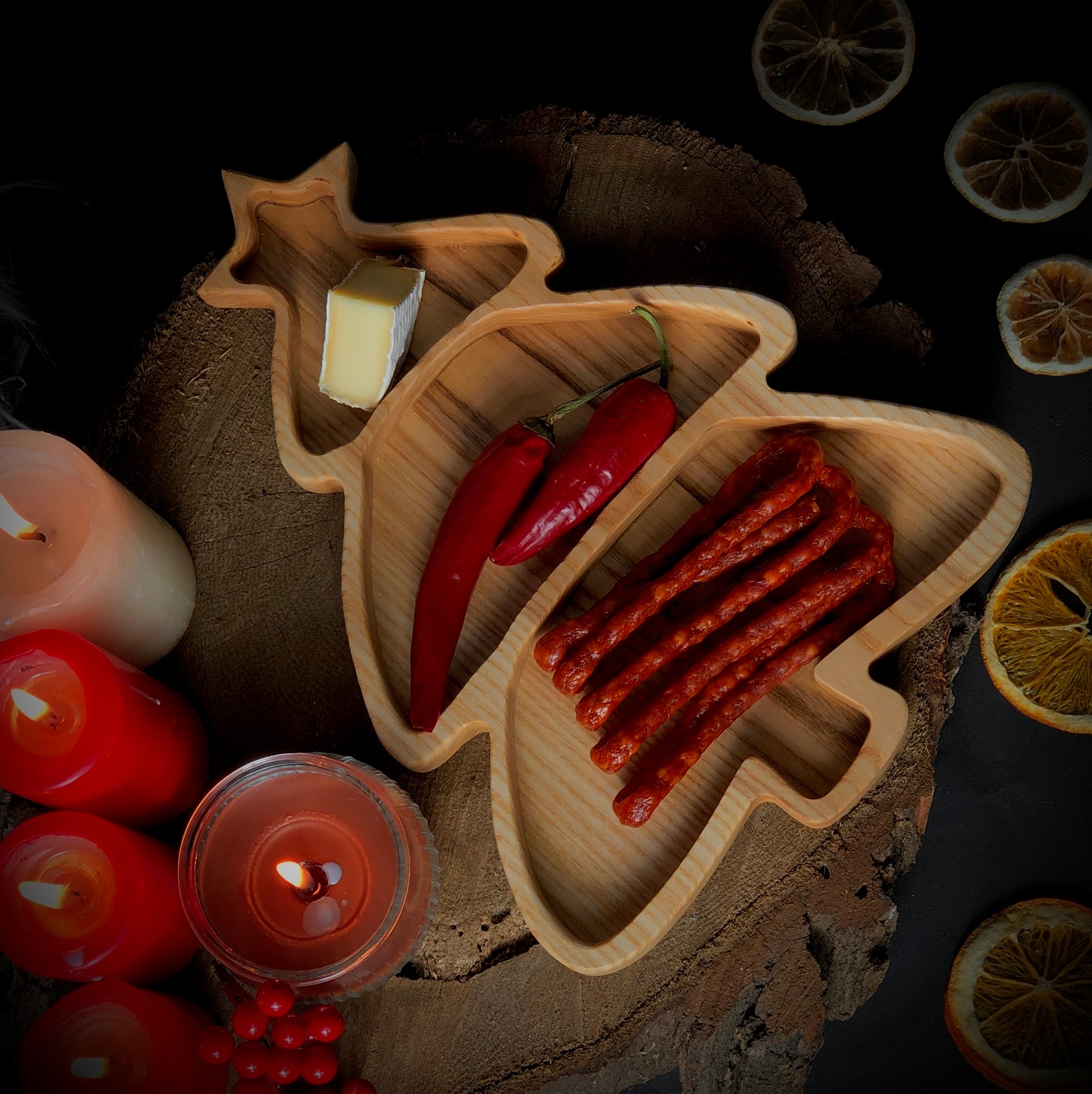Wooden Christmas plate with festive treats and ornaments