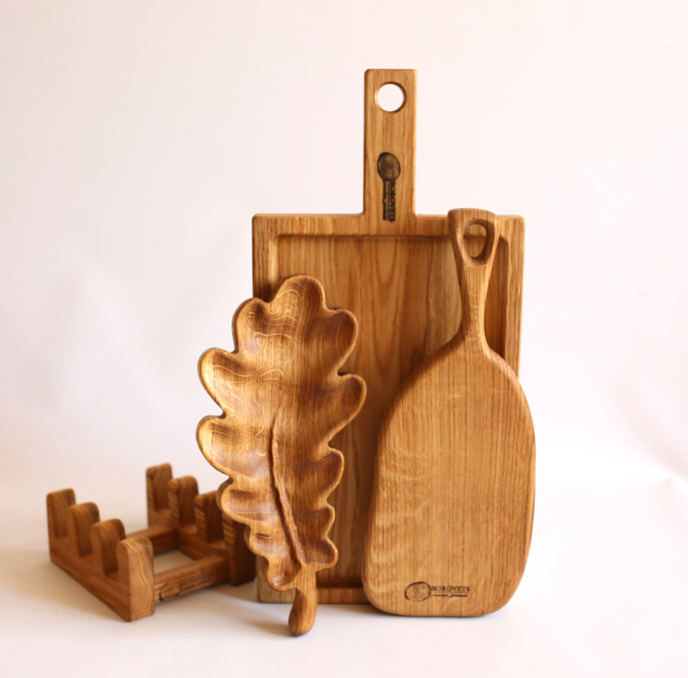 Handcrafted wooden snack and cheese boards arranged as a thoughtful Christmas gift for family.