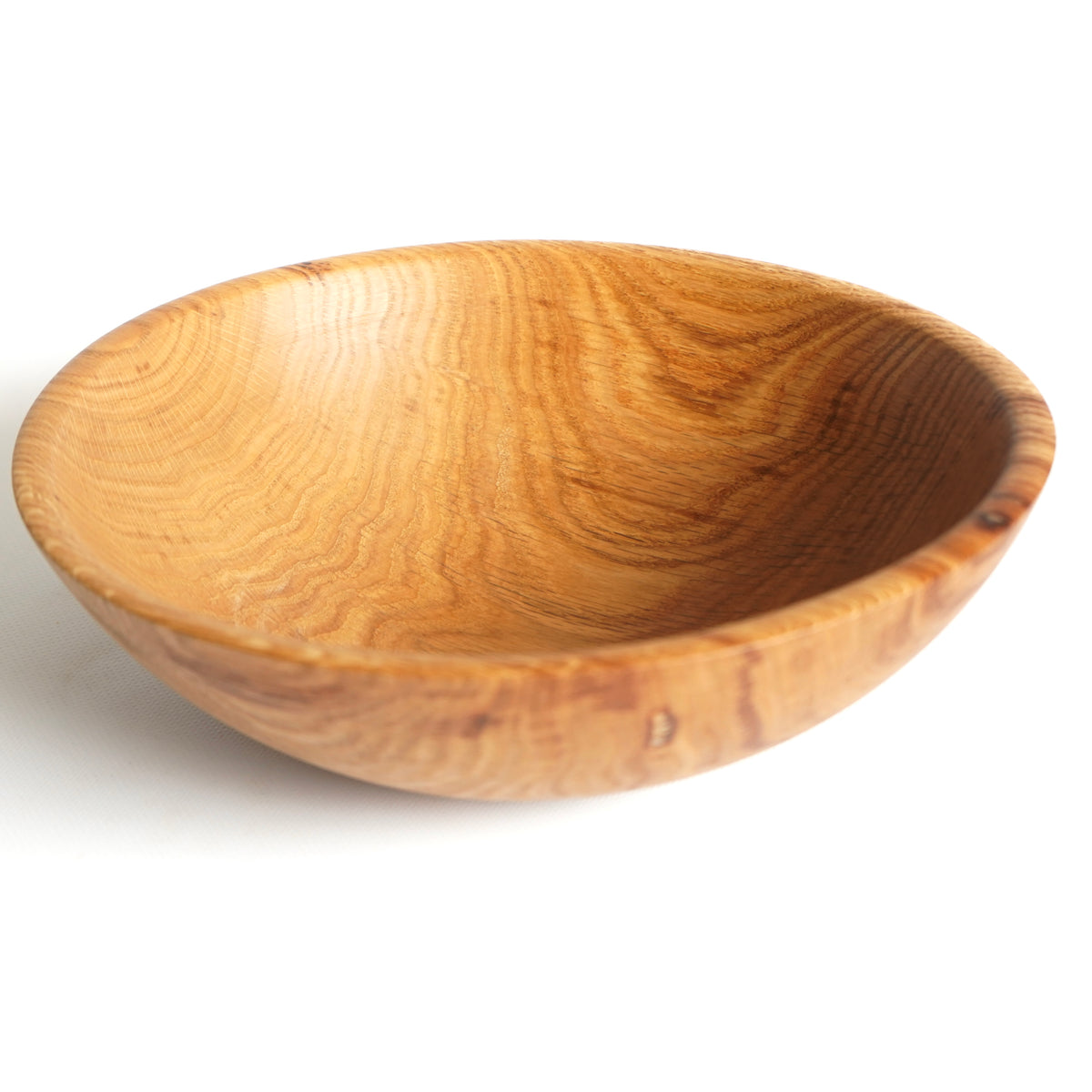 Handmade oak wood salad bowl with natural wood grain

