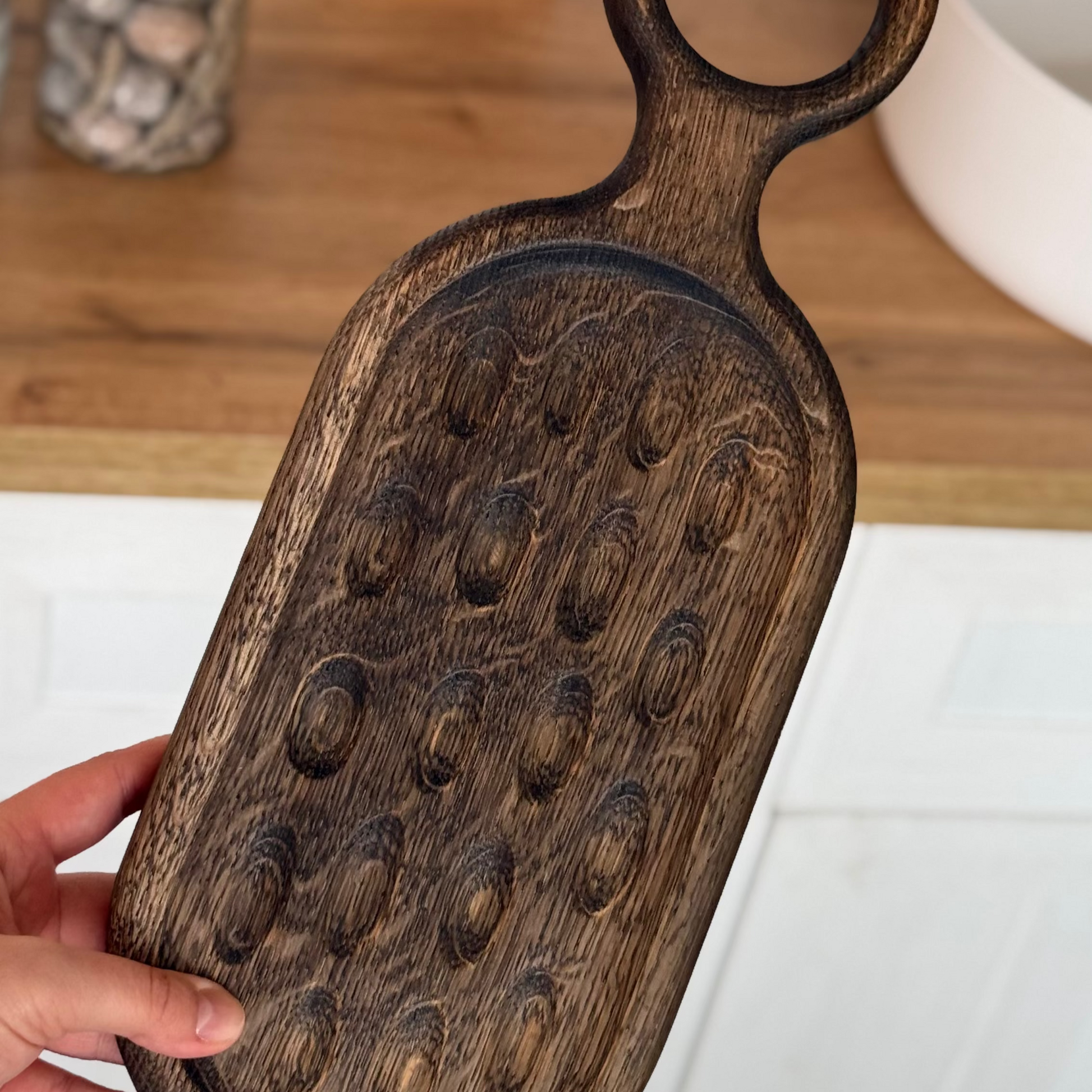 Charcuterie and wine on oak board in Christmas setting