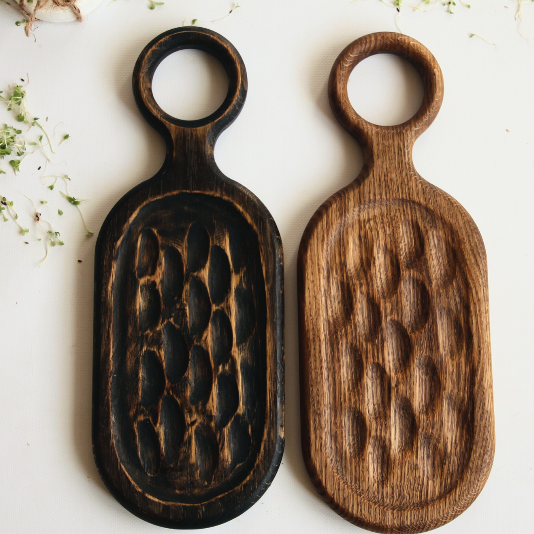 Charcuterie and wine on oak board in Christmas setting