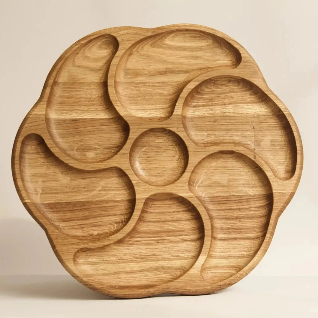 Handmade oak serving boards arranged on wooden stand