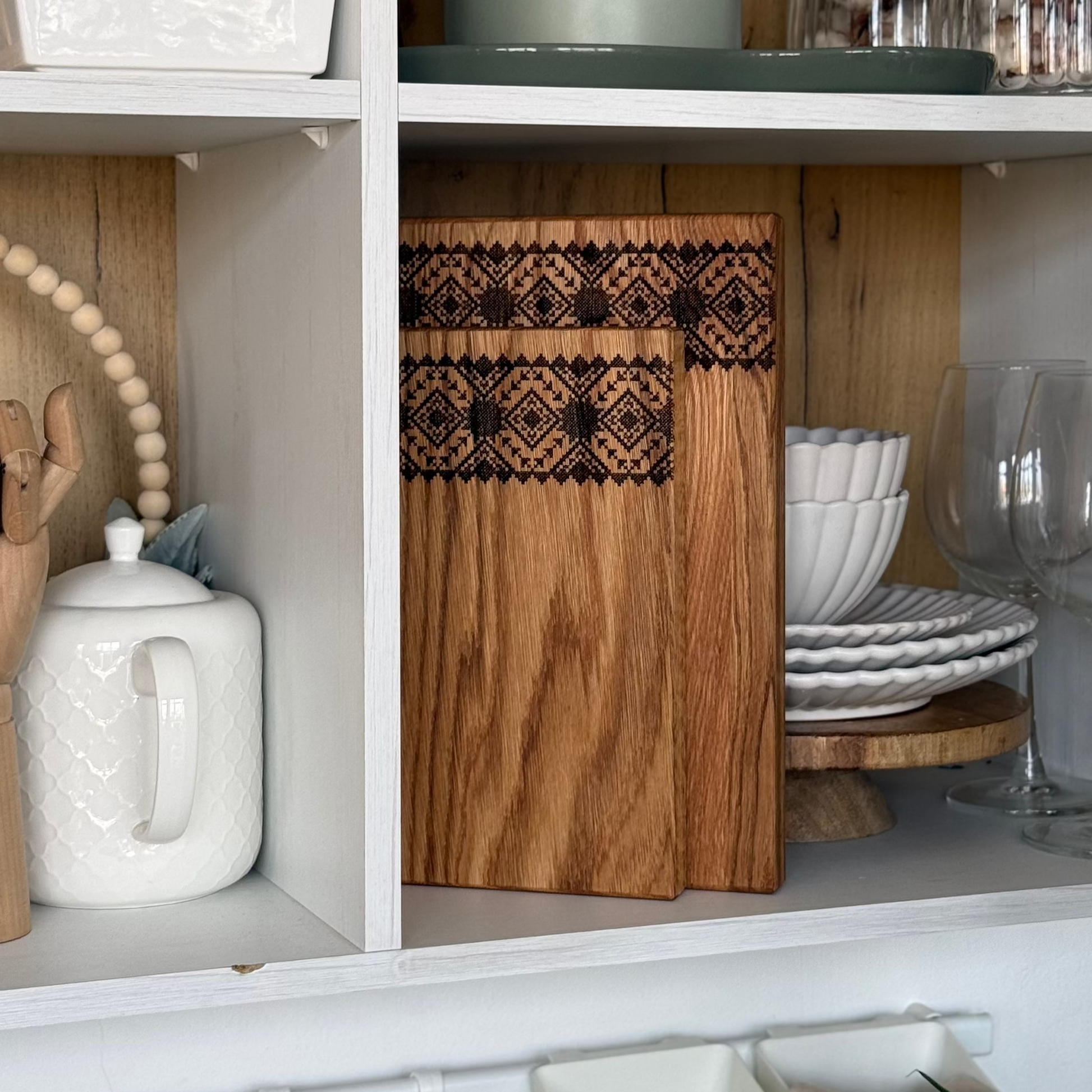 Three wooden cutting boards with traditional Ukrainian engraving