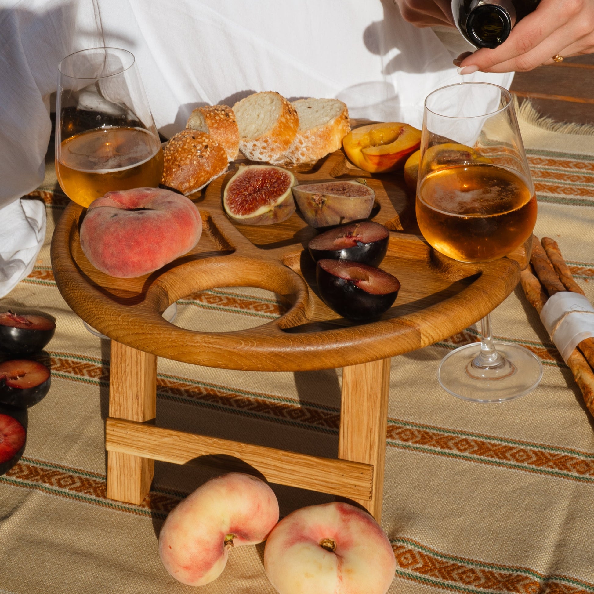 Picnic wine table with foldable legs and rustic texture