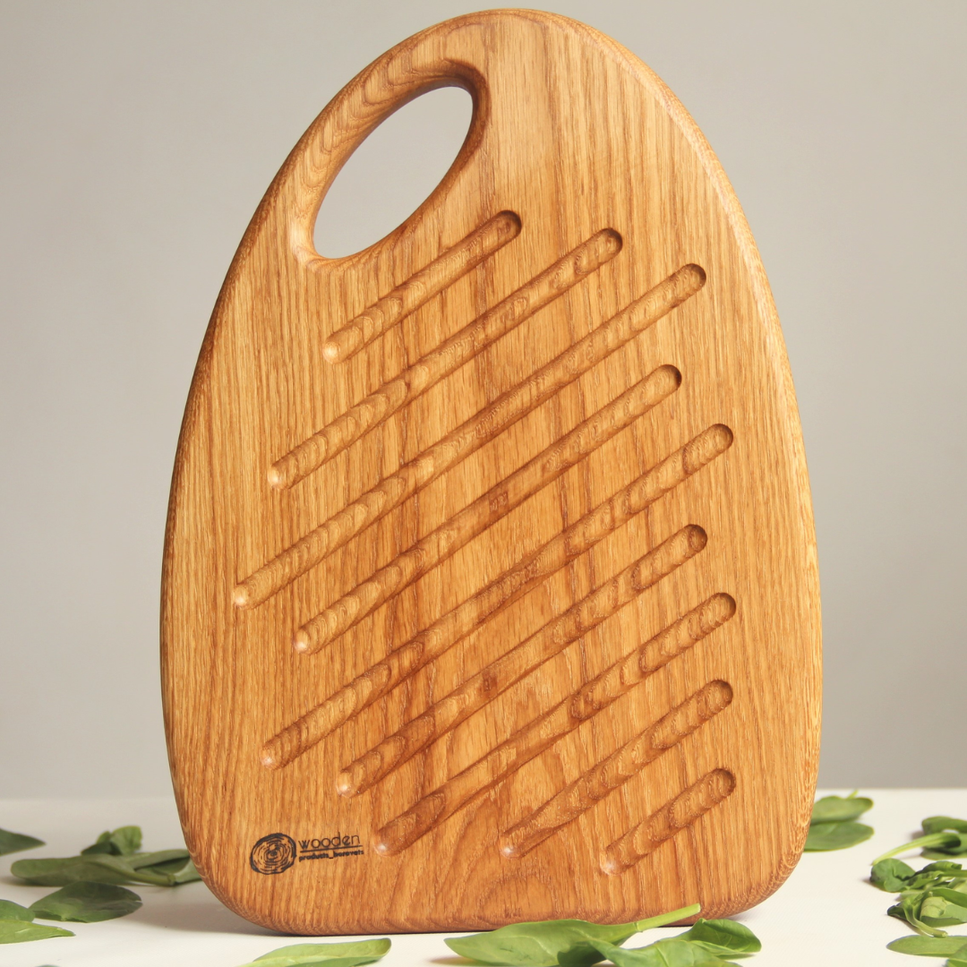 Cutting board wrapped as a Christmas gift with red ribbon