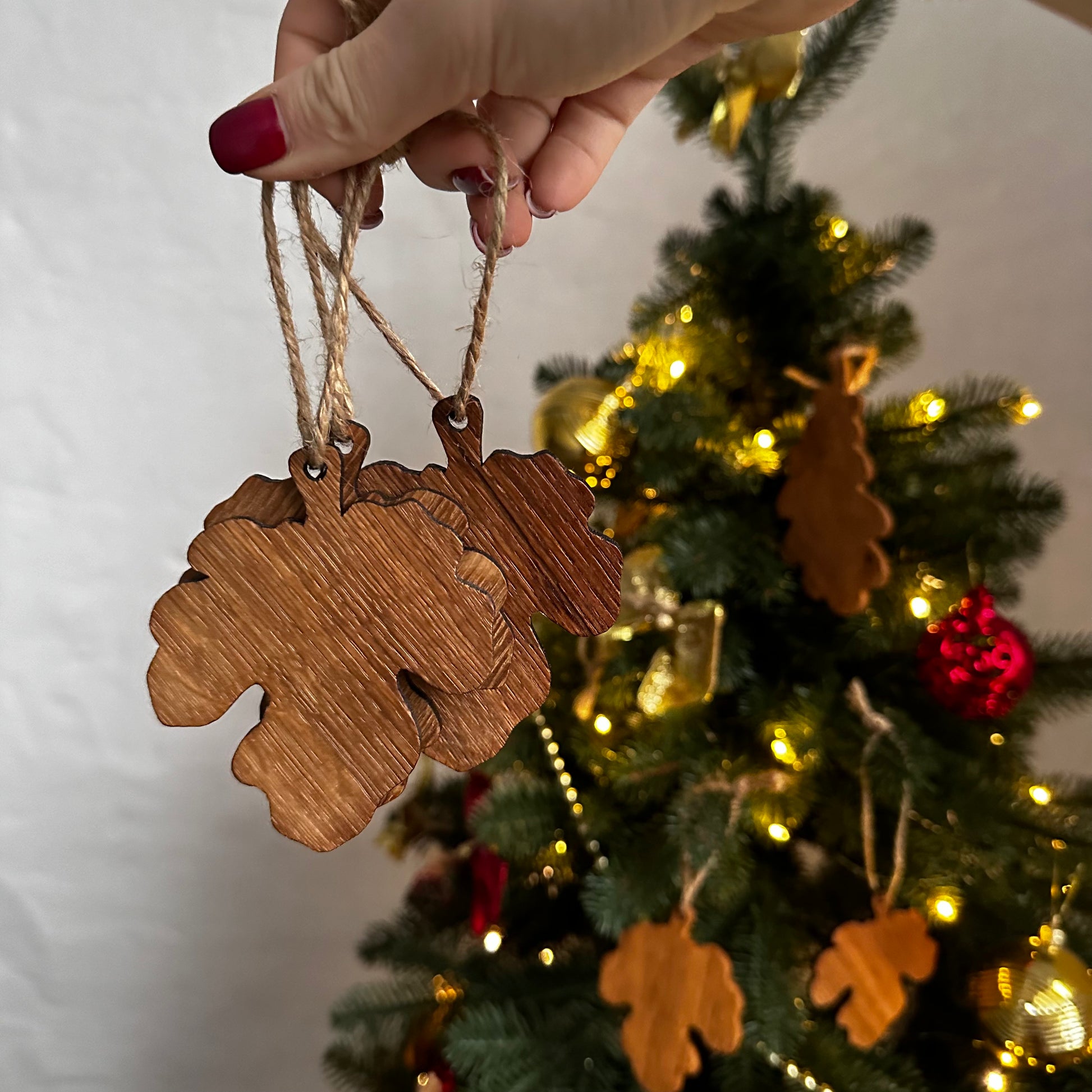 Handcrafted Christmas tree decorations made of oak wood