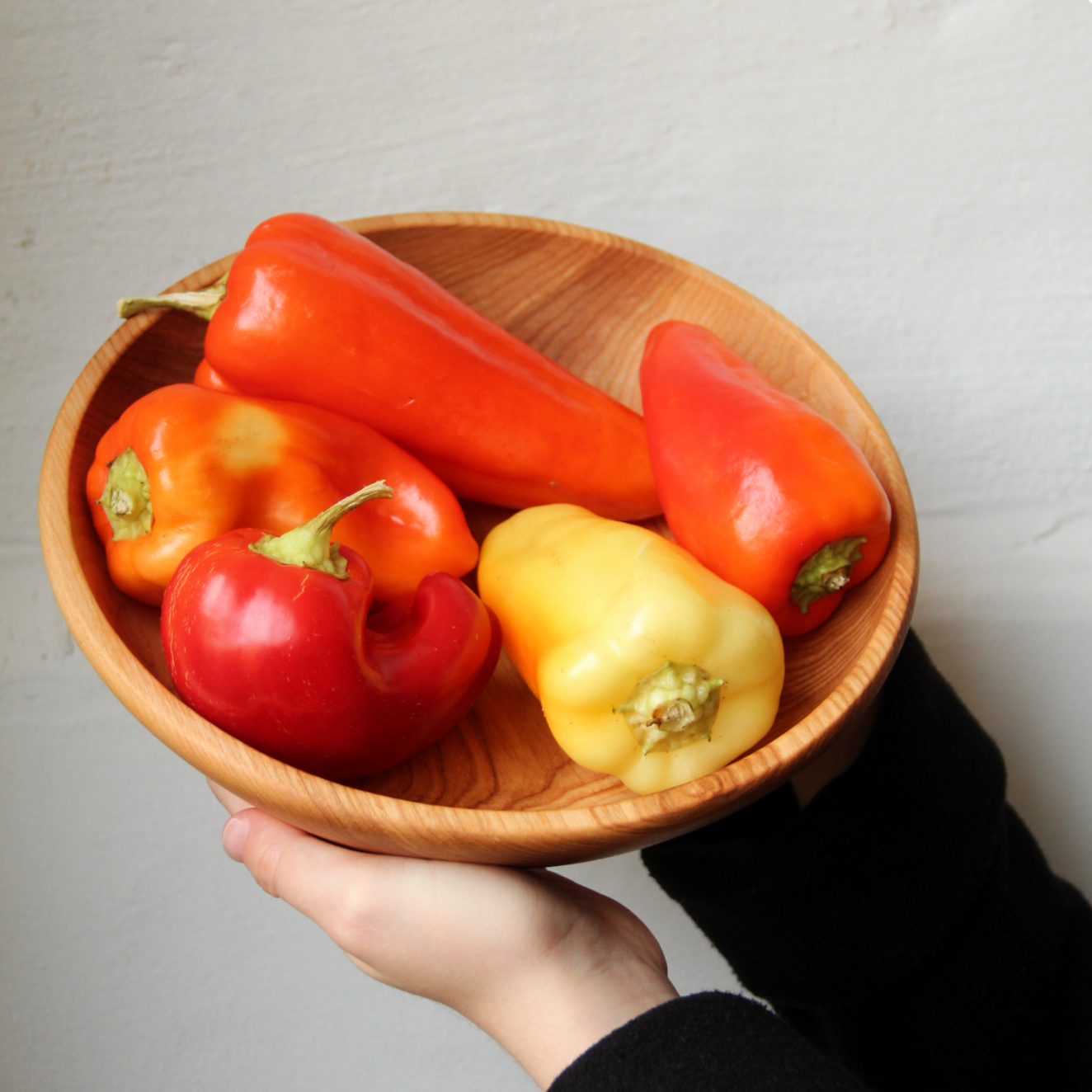 Natural wooden round bowl for salads, fruits, or side meals