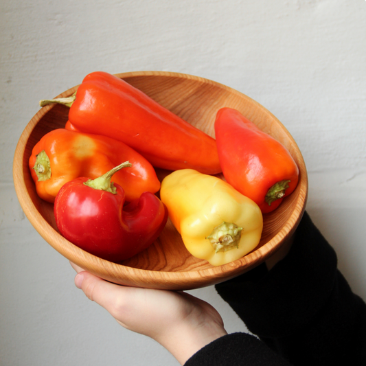 Natural wooden round bowl for salads, fruits, or side meals