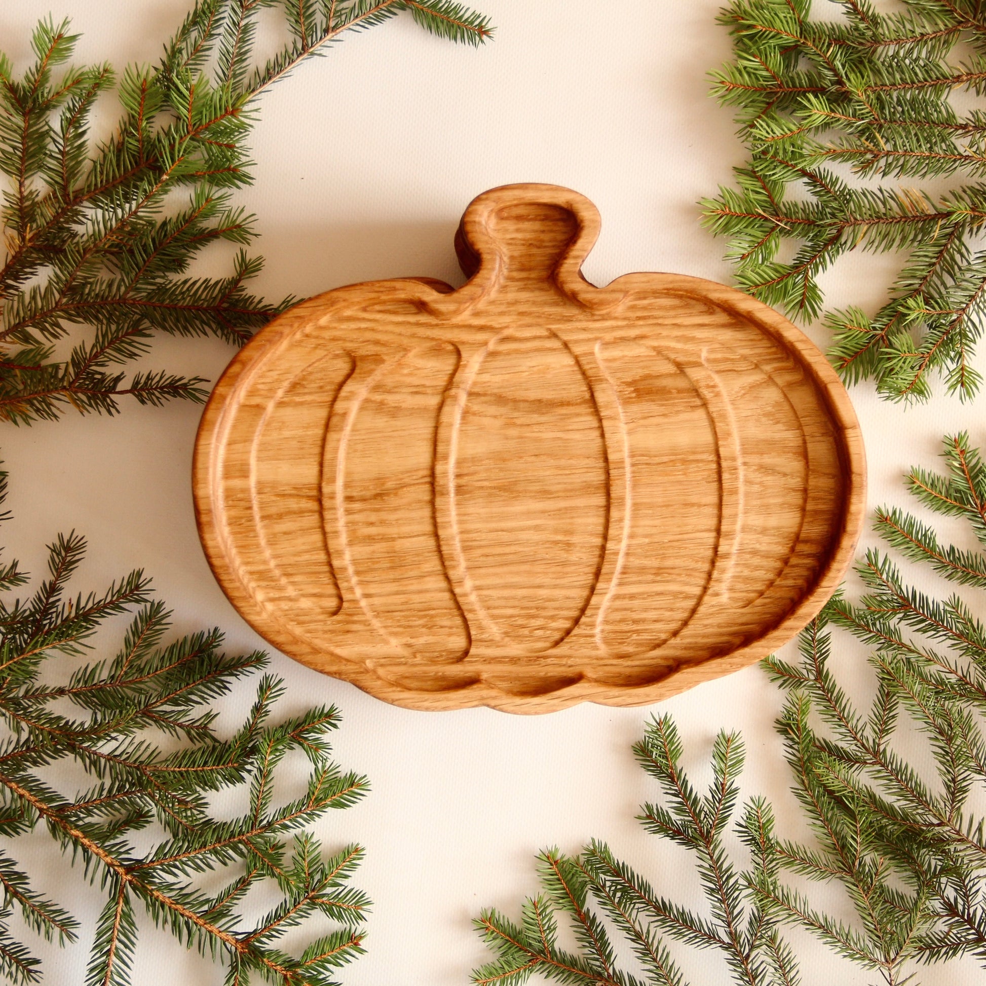 Handcrafted oak pumpkin plate with natural finish for festive decor