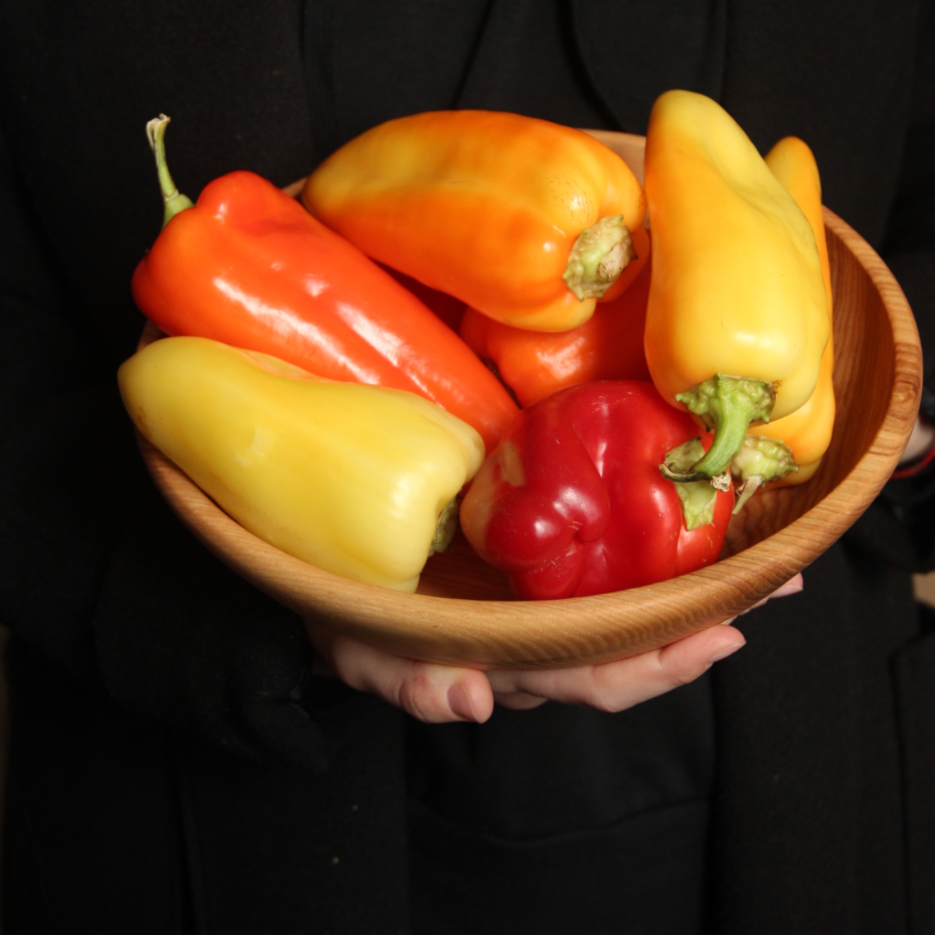 Handmade round wooden salad bowl made of natural ash wood