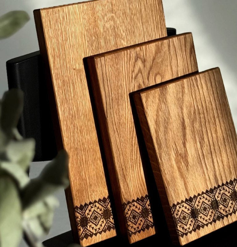 Set of engraved wooden boards for food preparation and display