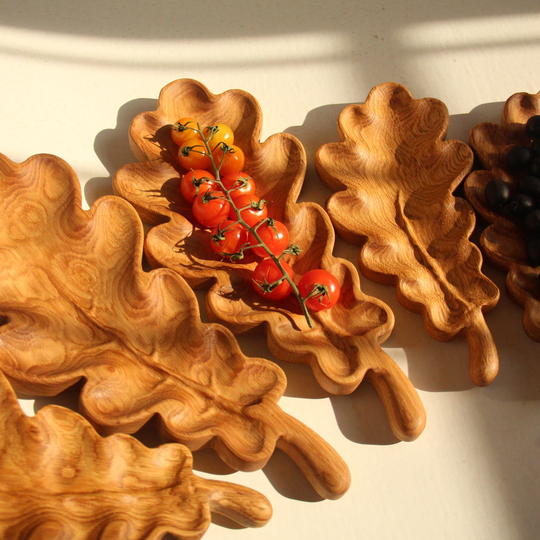 Rustic oak leaf shaped wooden plate for holiday appetizers and candies