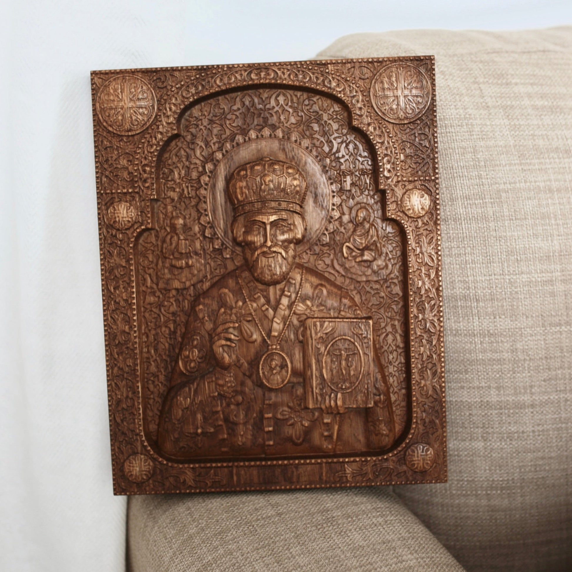 Hand-carved wooden icon of Saint Nicholas made from natural oak wood