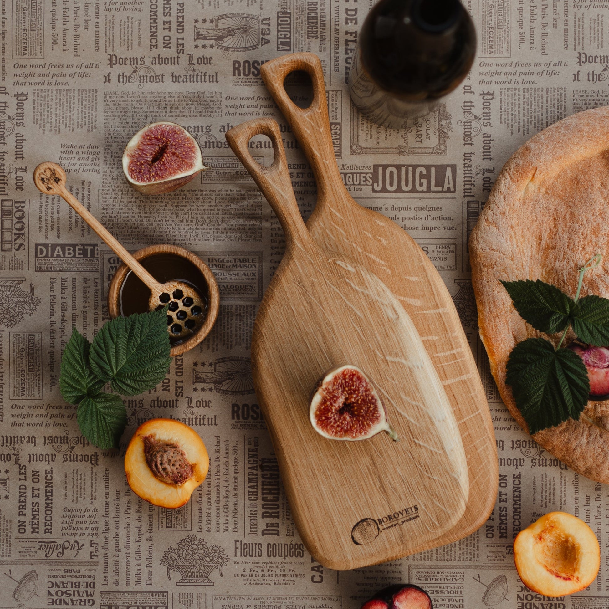 Oval oak cutting board on white background