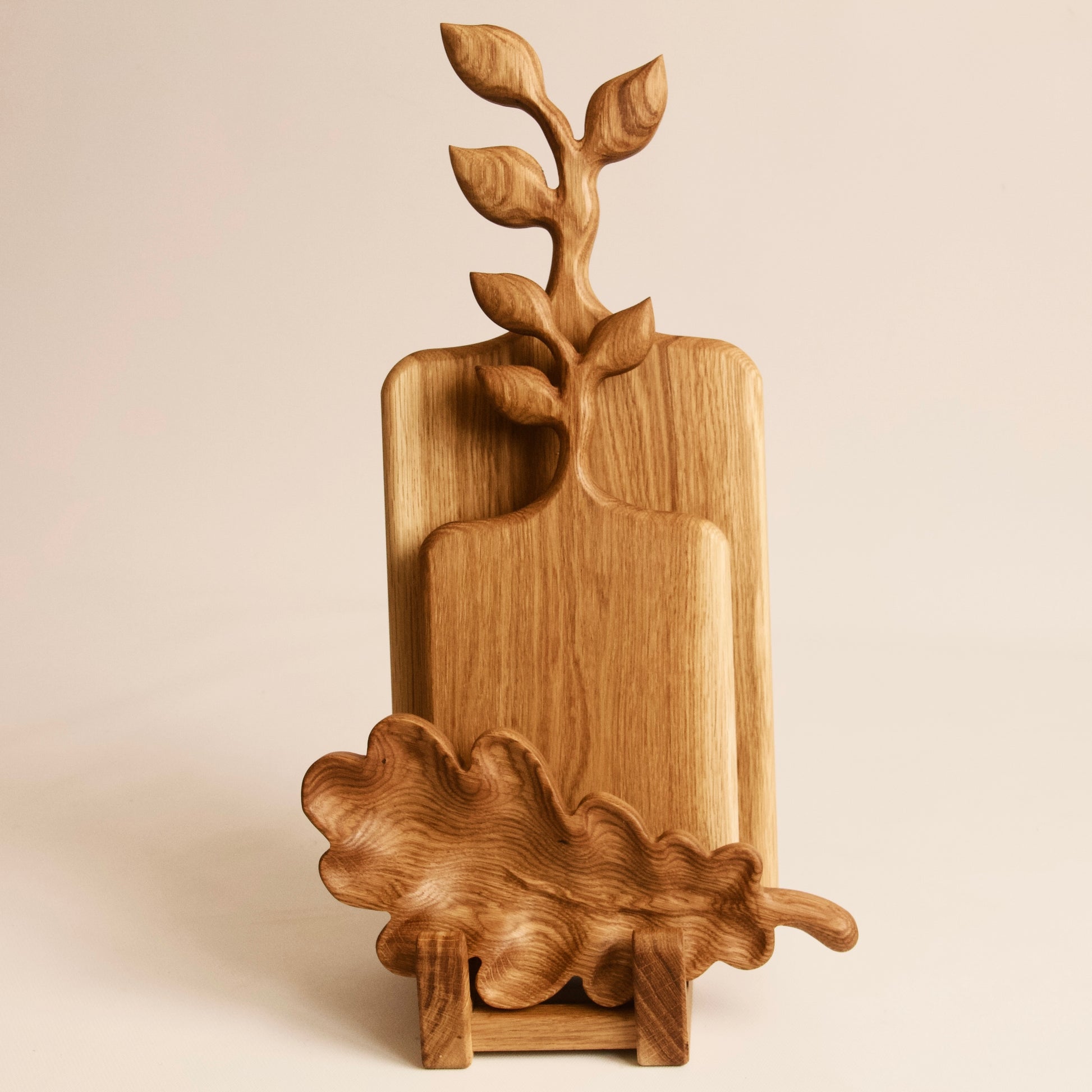 Rustic wooden serving board set with elegant oak leaf design