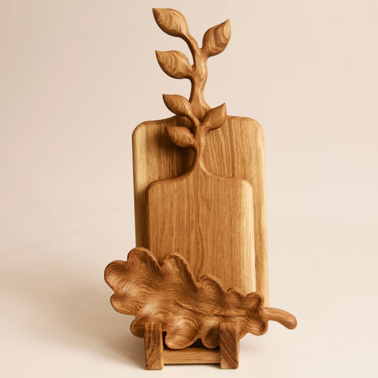 Rustic wooden serving board set with elegant oak leaf design