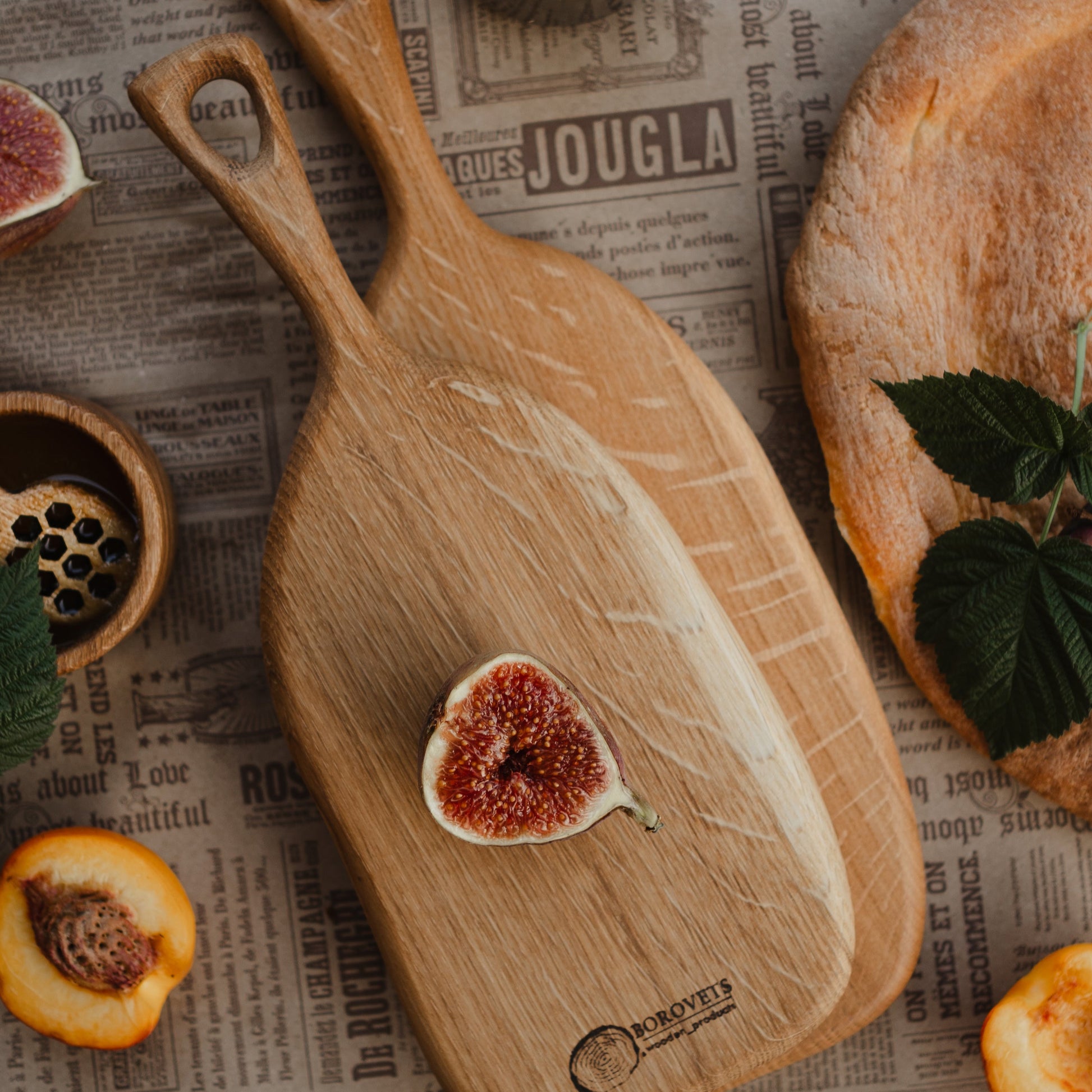 Serving cheese and snacks on oval wooden board